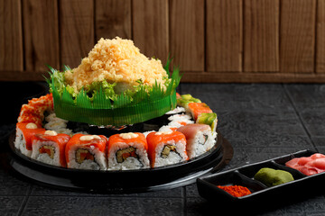 Sushi cake consists of uramaki sushi and norimaki sushi. Perfect for recipe, article, catalogue, or any commercial purposes.