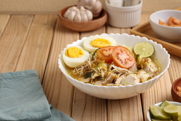 Soto ayam Lamongan. Lamongan chicken yellow soup. Perfect for recipe, article, catalogue, or any commercial purposes.
