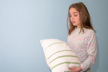 girl woke up with a pillow in her hands