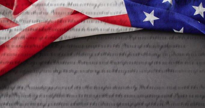 Animation of american constitution text over american flag and grey background