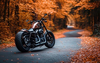 Obraz premium A motorcycle parked on a winding road surrounded by vibrant autumn foliage.