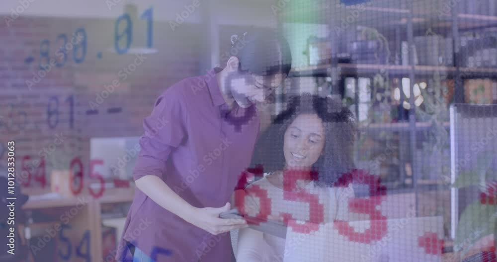 Aufkleber animation of financial data over diverse female colleagues using computer talking in office