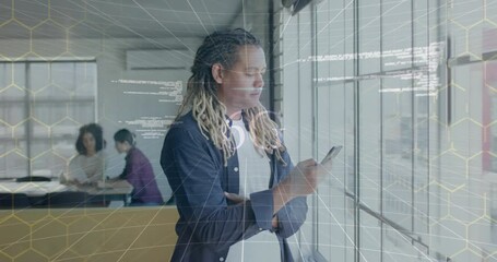 Animation of 6g text and data processing over biracial casual businessman using smartphone in office - Powered by Adobe