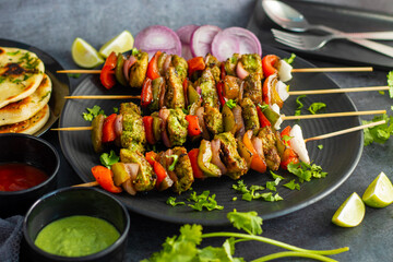 Selective focus of Succulent Hariyali Chicken Tikka Kabab, A Flavorful Blend of Herbs, Spices, and Grilled to Perfection