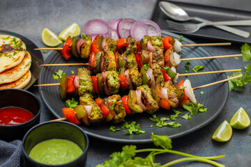 Selective focus of Succulent Hariyali Chicken Tikka Kabab, A Flavorful Blend of Herbs, Spices, and Grilled to Perfection
