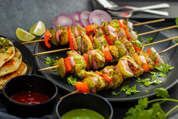Selective focus of Succulent Hariyali Chicken Tikka Kabab, A Flavorful Blend of Herbs, Spices, and Grilled to Perfection