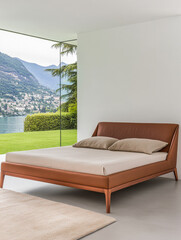Modern leather bed in serene lakeside home overlooking picturesque mountains
