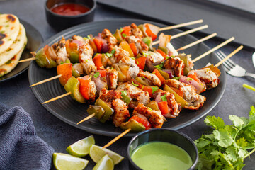 Chicken Reshmi Kabab is a succulent, marinated chicken dish, grilled to perfection, featuring a blend of spices, cream, and cashews. Selective focus.