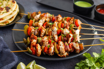 Chicken Reshmi Kabab is a succulent, marinated chicken dish, grilled to perfection, featuring a blend of spices, cream, and cashews. Selective focus.