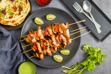 Chicken Reshmi Kabab is a succulent, marinated chicken dish, grilled to perfection, featuring a blend of spices, cream, and cashews. Selective focus.