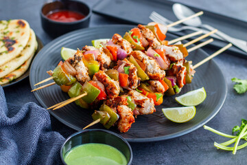 Chicken Reshmi Kabab is a succulent, marinated chicken dish, grilled to perfection, featuring a blend of spices, cream, and cashews. Selective focus.
