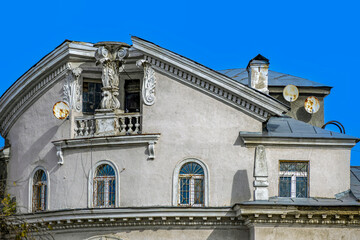 A fragment of the facade of a historic building on an autumn day