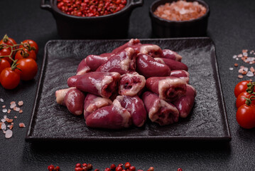 Raw chicken hearts with salt, spices and herbs