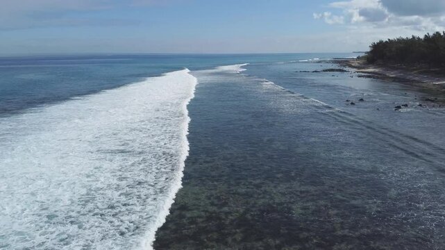 Aerial view in Mauritius over Pointe aux Piments beach, a beautiful tropical beach in the Indian Ocean