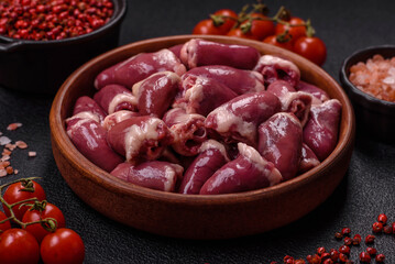 Raw chicken hearts with salt, spices and herbs