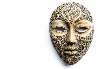 An intricately detailed hand-carved mask stands out against a pure white backdrop, highlighting the skillful artistry and craftsmanship involved.