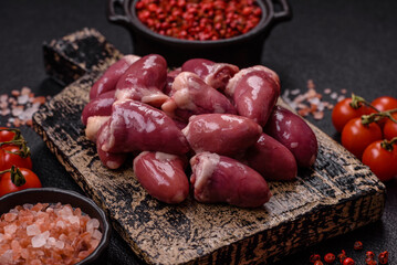 Raw chicken hearts with salt, spices and herbs