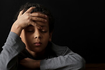 boy in poverty being bullied at school with depression no help crying alone and all by himself on...