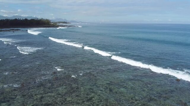 Aerial view in Mauritius over Pointe aux Piments beach, a beautiful tropical beach in the Indian Ocean