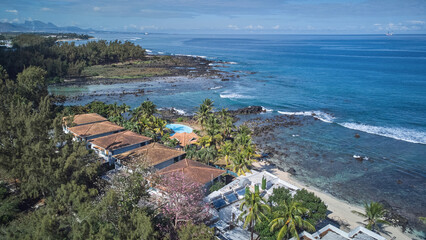 Aerial view in Mauritius over Pointe aux Piments beach, a beautiful tropical beach in the Indian...