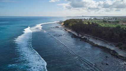 Obraz premium Aerial view in Mauritius over Pointe aux Piments beach, a beautiful tropical beach in the Indian Ocean