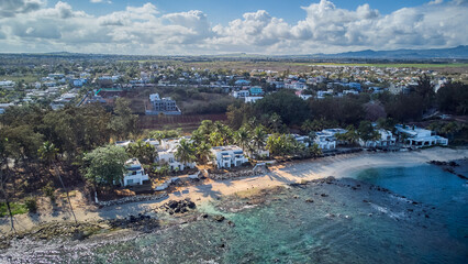 Aerial view in Mauritius over Pointe aux Piments beach, a beautiful tropical beach in the Indian...