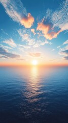 Fototapeta premium A serene sunset over calm ocean waters, with vibrant clouds reflecting the warm colors.