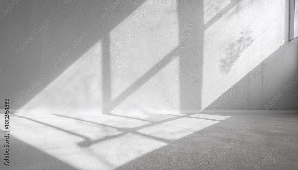 Poster minimalist white empty room with shadow light from window on concrete wall texture background