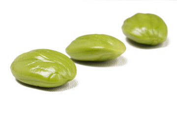 Fresh green stinky bean (petai) seeds, ready for use in sambal, vegetables, or as a side dish. Photographed on a white background. Scientific name: Parkia speciosa.