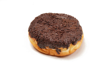 A whole donut without a hole, topped with hardened chocolate glaze and generously covered in chocolate sprinkles. Photographed on a white background.
