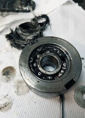 Ball bearing of a car on the background of old car parts.