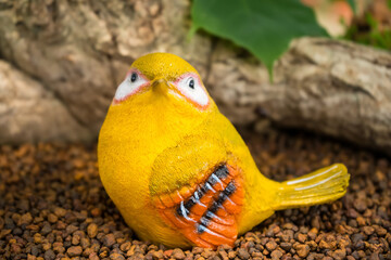 Decorative Yellow Bird in Garden