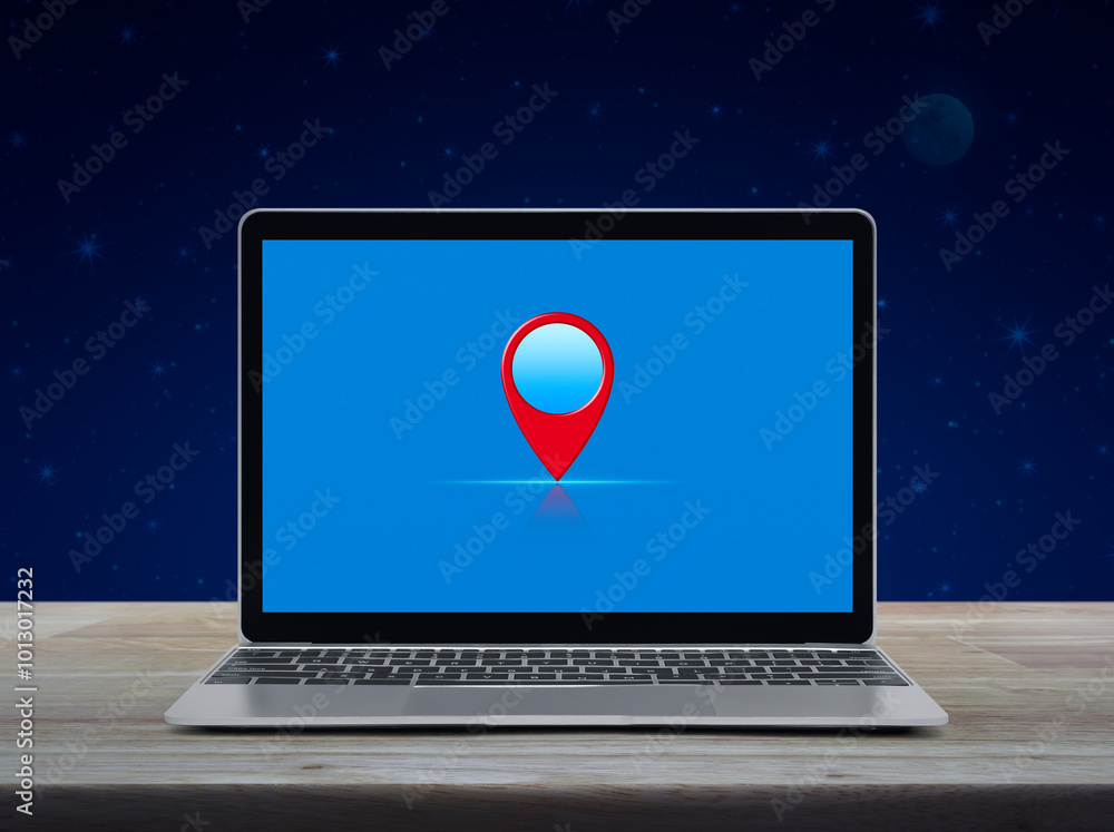 Poster map pin point location button on modern laptop computer screen on wooden table over fantasy night sk