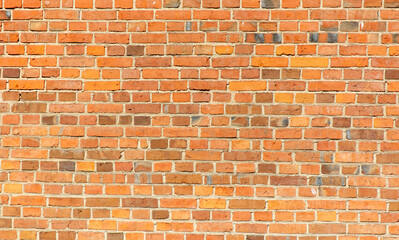 A brick wall with a red color