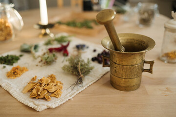 Process of preparing nutritional supplements to improve human immunity and health. Dried herbs and seasonings. Mortar and pestle