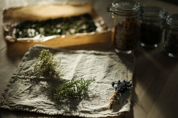 Bunch of fresh herbs on wooden table at home. Rosemary, thyme and lavender