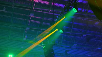 High Luminance Stage Disco Lights Casting Colorful Light Beams during Concert Gig Performance in...