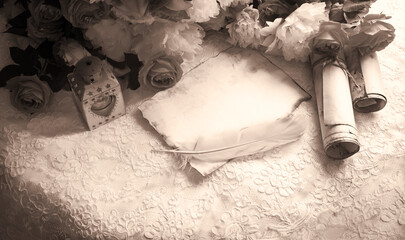 Paper with quill and flowers