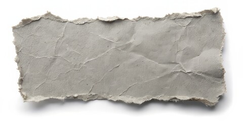 A grey tattered paper fragment set against a white background, ideal for diverse creative projects. This eye-catching