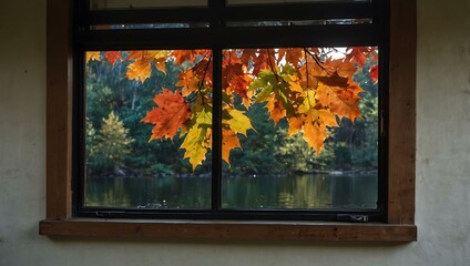 Vibrant autumn leaves reflected in calm water, framed by a cozy window.
