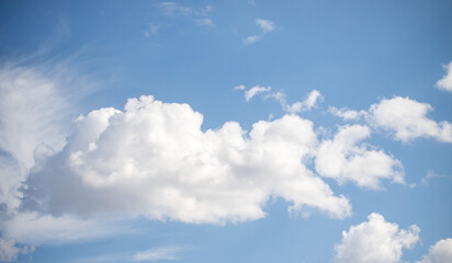 A blue sky with a few clouds