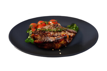Capture the juicy, perfectly cooked steak alongside fresh cherry tomatoes on a plate. Perfect for menus, this close-up emphasizes the rich, mouth-watering presentation.