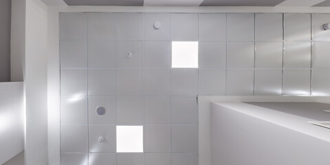 Fototapeta premium cassette stretched or suspended ceiling with square halogen spots lamps and drywall construction in empty room in house or office. Looking up view