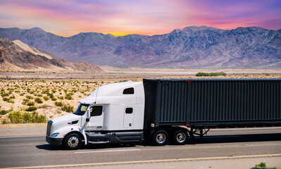 Semi truck on highway hauling freight, Nevada, USA	
