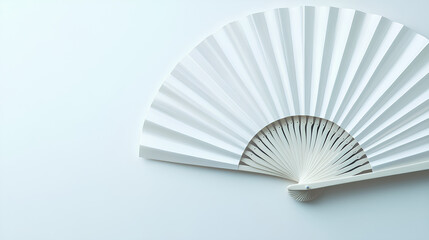 Mockup of a white folding hand fan set apart against a white background 