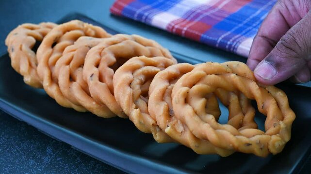 Serving kai murukku Indian snack in a plate.