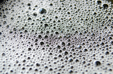 Close up view of bubbles on dark background with customizable space for text