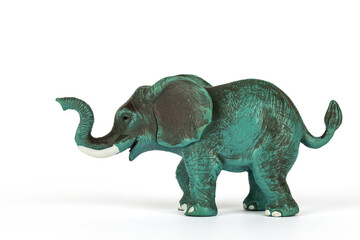 Green and grey plastic toy elephant isolated on white background. Concept of jungle animals and mammals