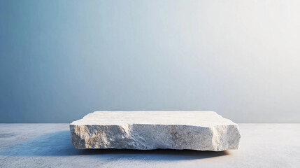 Raw Stone Pedestal on Light Blue Background for Product Display. Minimalist Rock Platform for Modern Design and Presentations.