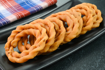 Kai Murukku indian snack dish served in a plate.